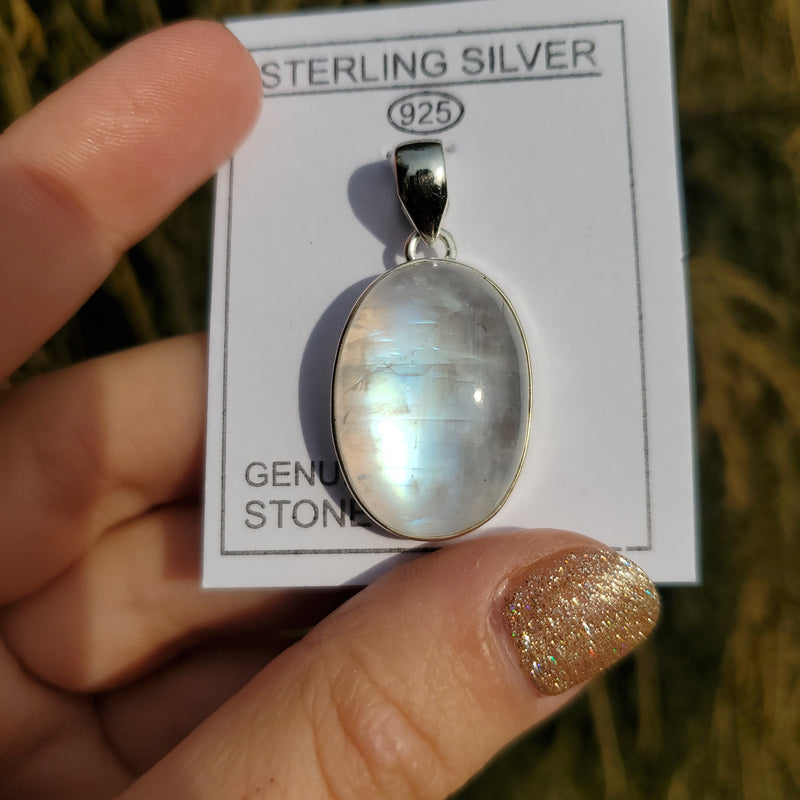 Oval Rainbow Moonstone set in Sterling Silver Crystal Pendant